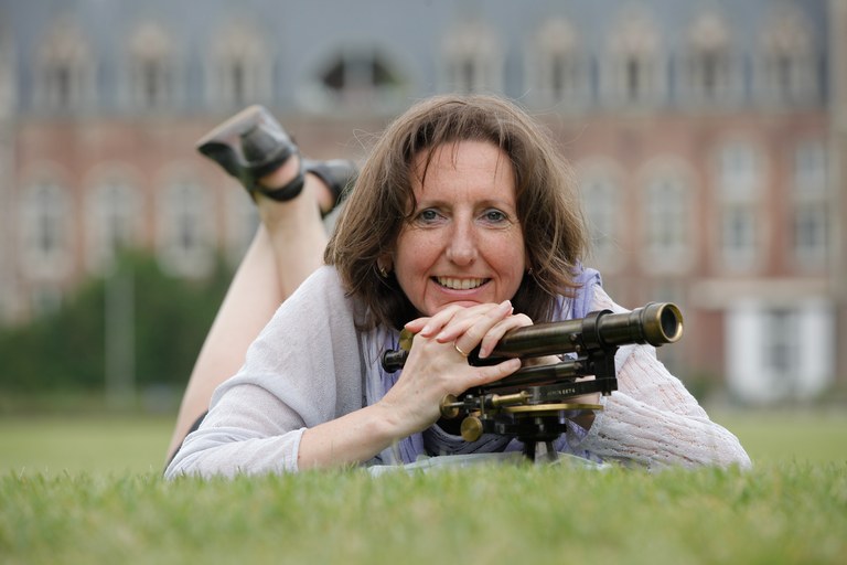 profile photo of a woman lying down on the grass